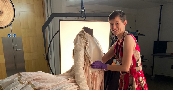 Annabelle Camp with the Indian court ensemble she helped preserve and prepare for exhibition.