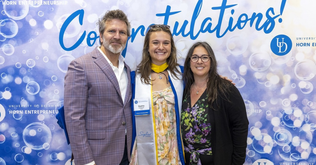 Sophia Cressman with parents at 2025 Horn Grad Party